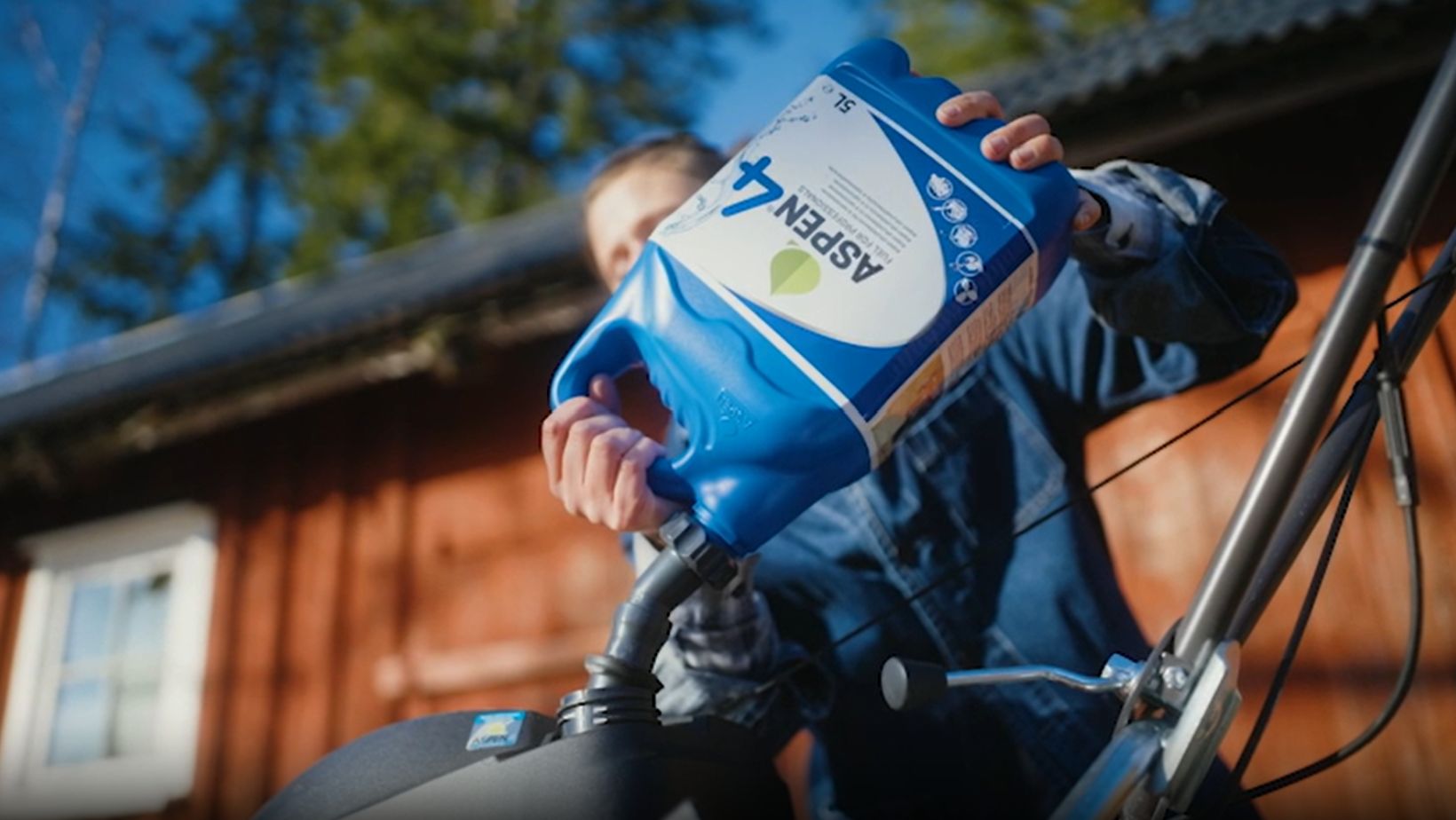 Aspen fuel being used to fill up fuel in a lawn mower